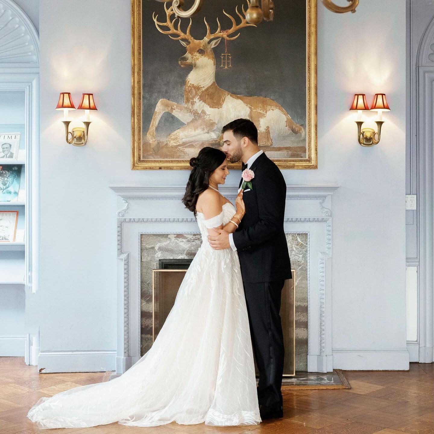 bride kissing groom on the forehead