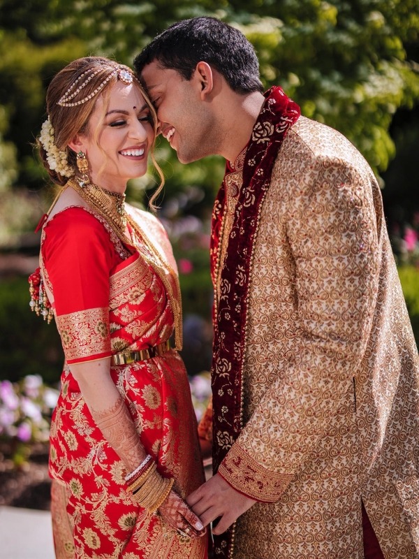 Indian bride and groom smiling